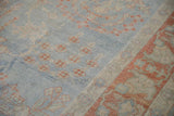 Even wear across the hand-knotted pile of a vintage Mahal, with powder blue and rust floral details.