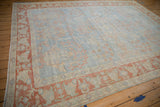 Angled perspective of a distressed Persian Mahal carpet with a soft, evenly worn powder blue pile.