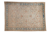 Distressed vintage Persian carpet with scrolling palmettes and sickle leaves in sand, copper, and dusty blue.