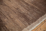 Abstract brown and beige striated pile texture on a vintage Tulu carpet.