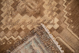 Distressed Kars carpet: brown and beige geometric pile, original side cord, macrame.