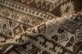 Low pile texture and reciprocating pawn design on a vintage distressed Kars carpet.