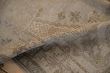 Faded geometric patterns and woven texture on a Vintage Distressed Oushak rug.