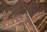 Close-up of the vintage Khotan carpet's secured side cord selvage and woven foundation.