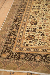 Angled close-up of the Kaisary carpet's intricate floral borders and original side cord.