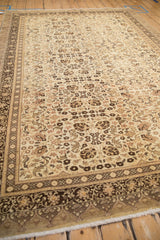 A perspective view of the vintage Kaisary carpet's intricate floral patterns and complex, multi-layered border.