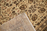 Corner view of a vintage Kaisary carpet showing the floral pile and hand-knotted foundation.