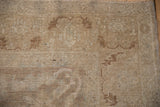 Distressed low pile of a vintage Oushak carpet with notable wear to the knot heads.