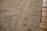 Secured side cord and visible knot heads on a distressed hand-knotted Oushak carpet.