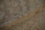 Hand-knotted weave of a distressed Oushak carpet, showing wear to the foundation and knot heads.
