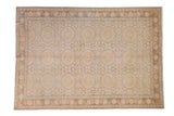 Vintage distressed Kaisary rug with an allover pattern of roundels in muted ivory, blush, and charcoal.
