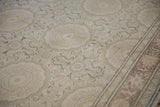 The low-pile texture and even wear of a distressed Turkish Kaisary carpet with roundel medallions.