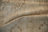 Detailed view of the distressed texture and mostly even wear on a vintage Kaisary carpet.