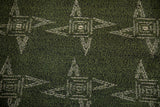Ivory starburst pinwheel design on deep mallard green vintage Sparta carpet pile.
