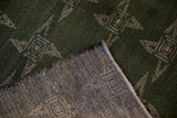 Hand-knotted reverse and dark green pile of the vintage Sparta carpet, showing color migration.
