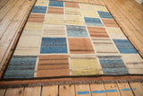 Robust woven fringe and dark chocolate brown outer border on the vintage Gabbeh rug.