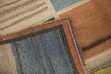 Intact multicolored selvage, fringe detail, and textured blue, copper, brown Gabbeh pile.