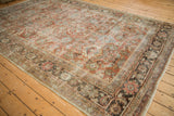 Distressed Mahal's intricate copper and dusty blue floral patterns with foundation showing through.