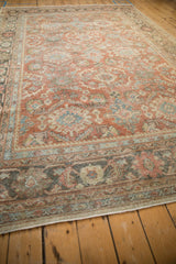 Detail of vintage distressed Mahal carpet showcasing worn copper field, palmettes, and oxidized silver border.