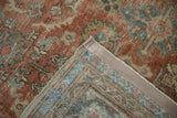 Corner of a vintage Mahal carpet revealing foundation, worn knot heads, and secure selvage.
