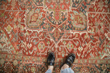 Vintage distressed Heriz rug with dusty cochineal, powder blue, and jade green patterns.