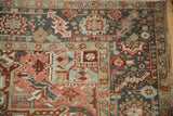 Distressed Heriz carpet, cherry red and dusty teal abrashed geometric pattern, worn pile.
