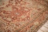 Heriz carpet with abrash and intricate curvilinear patterns in black cherry red, ivory.