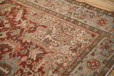 Distressed Heriz border with Samovar Turtle motif in dusty teal and brick red.