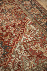 Distressed vintage Heriz carpet detail, showing rich red field, serrated leaves, and Samovar Turtle border.