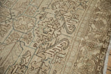 Close view of the samovar turtle border motif and low, even pile on a vintage Mehrivan carpet.