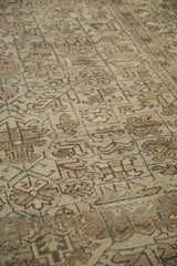 Evenly worn low pile of a vintage Mehrivan carpet, showing its geometric samovar turtle design.
