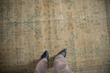 Antique Distressed Yezd carpet: delicate pale gold and sky blue floral patterns, worn pile.