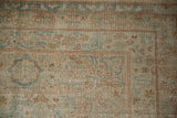 Antique Distressed Yezd carpet corner, revealing delicate dusty gold and sky blue blossom motifs with even wear.