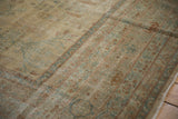 Antique distressed Persian Yezd carpet: pale gold, dusty blue, copper border and field motifs, even wear.