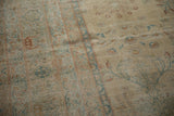 Distressed Yezd carpet texture with pale gold, sky blue, and copper blossom motifs.