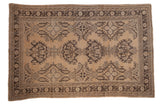 Distressed Oushak carpet featuring geometric floral columns in antique ivory and dark brown, 6'3
