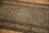 Intricate Herati pattern and geometric border with mostly even wear on a distressed Hamadan rug.