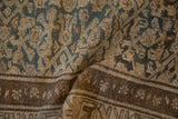 Distressed Hamadan runner detail revealing faded Herati pattern and rich brown border.