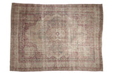 Antique distressed Kerman carpet with a starburst medallion and floral field in raspberry red and platinum.