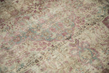 Worn pile texture of an antique Kerman carpet with raspberry, powder blue, and platinum floral motifs.
