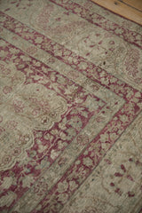 Low pile texture of a distressed antique Kerman carpet showing mostly even wear to knot heads.