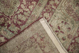 Back of an antique Kerman rug showing its hand-knotted foundation and secured side cord.