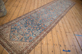 Diagonal view displaying the entire length of the antique Persian Malayer runner rug.