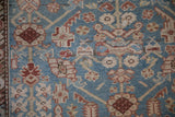 Even wear across the hand-knotted pile of an antique Malayer rug with blossom motifs.