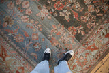 Distressed Lilihan carpet with striking abrash, powder blue and charcoal floral field.