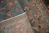 Visible distressed pile, unique abrash ground, floral pattern, and woven back of vintage Lilihan rug.