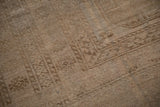 Distressed Ersari carpet pile, revealing tone-on-tone abrashes in camel and sand.