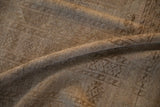 Distressed Ersari carpet texture with subtle camel and sand abrash tones.
