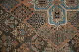 Intricate distressed Joshegan carpet patterns in sapphire blue, madder red, and rich brown tones.
