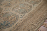 Distressed vintage Ersari carpet pile showing sand guls and abrashed dusty blue vine motifs.